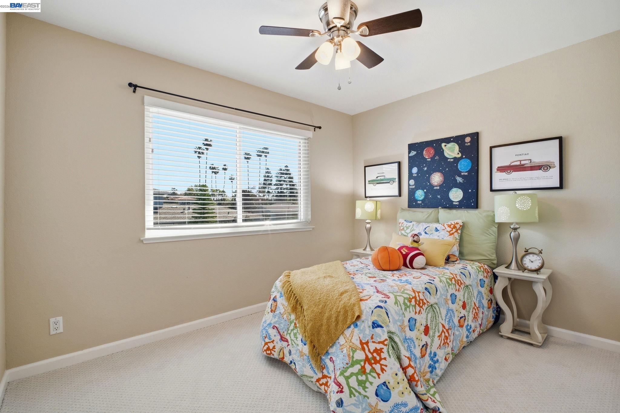 595 Seville Place Fremont, CA 94539 - Photo 17 of 43 a bedroom with a bed and a window