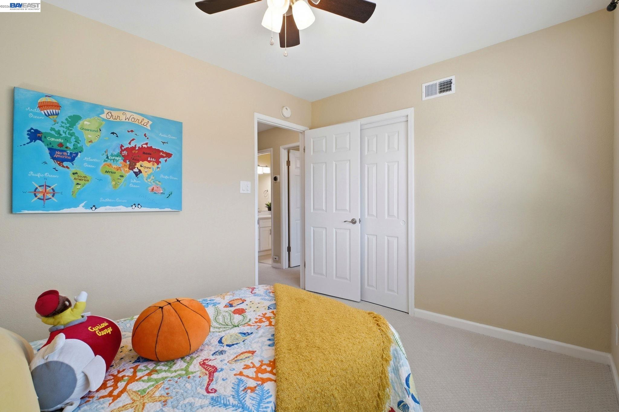 595 Seville Place Fremont, CA 94539 - Photo 18 of 43 a bedroom with a bed and painting on the wall