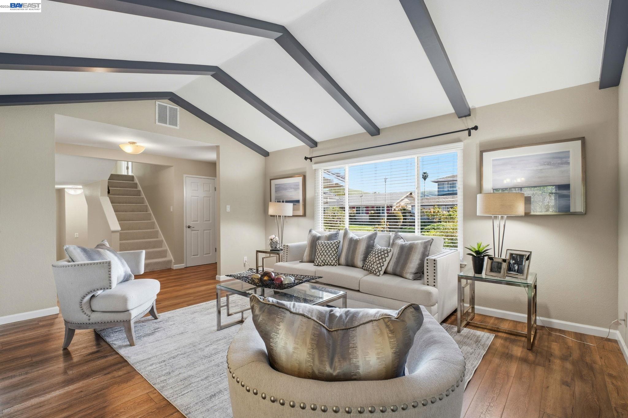 595 Seville Place Fremont, CA 94539 - Photo 4 of 43 a living room with furniture and a large window
