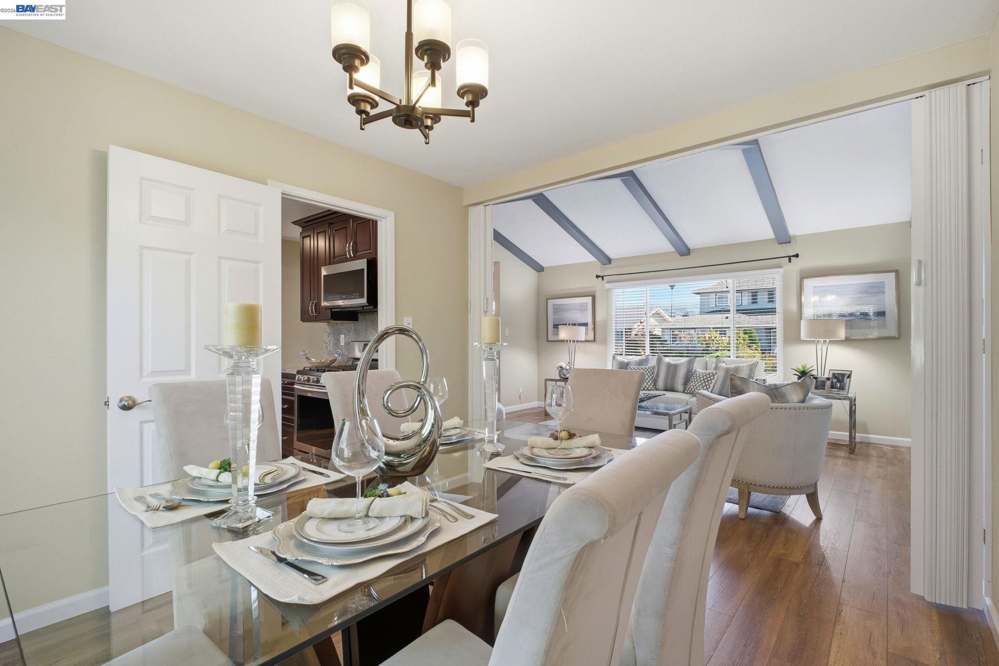 595 Seville Place Fremont, CA 94539 - Photo 7 of 43 a view of a dining room with furniture and wooden floor