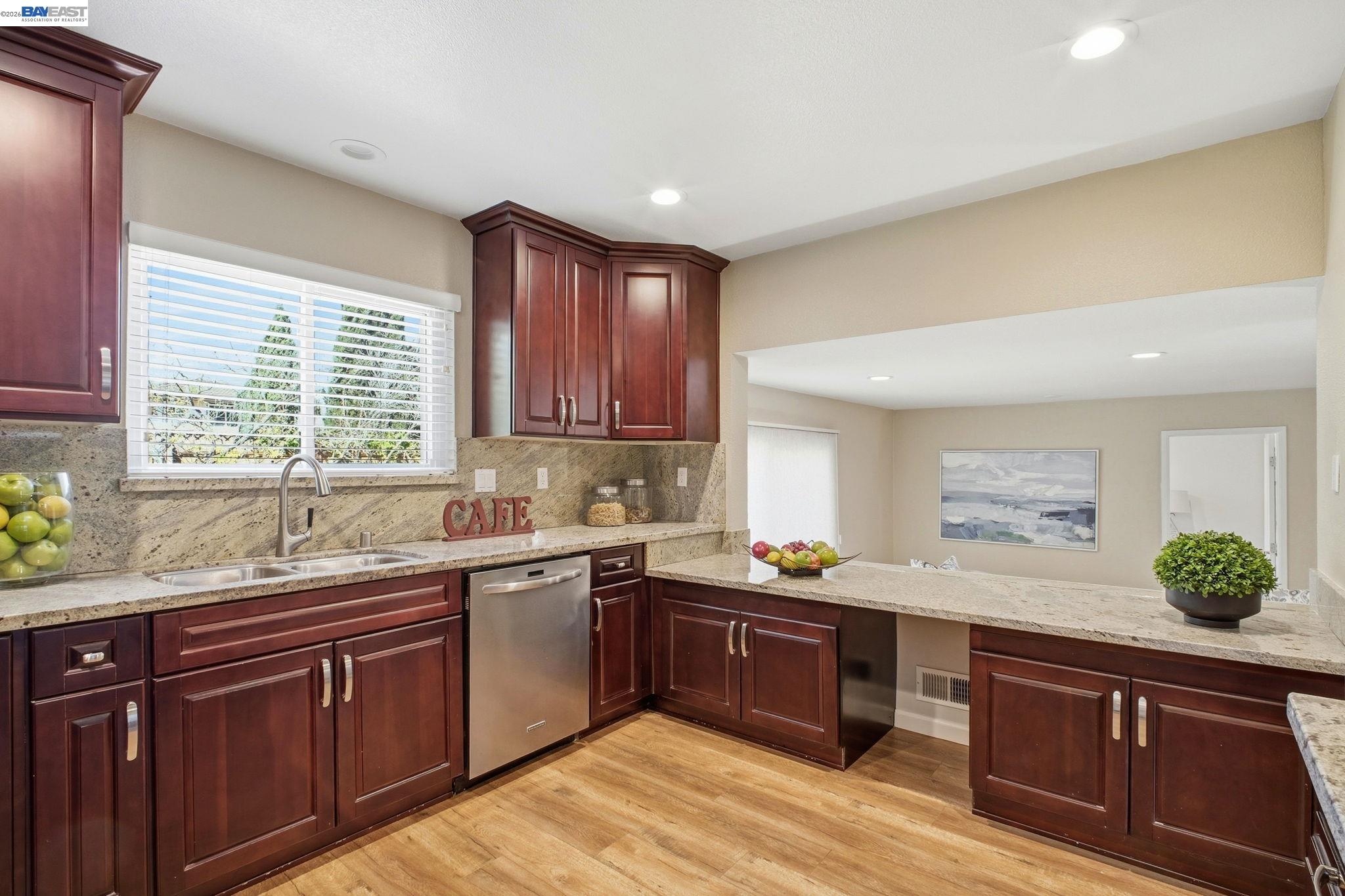 595 Seville Place Fremont, CA 94539 - Photo 8 of 43 a kitchen with a sink and cabinets