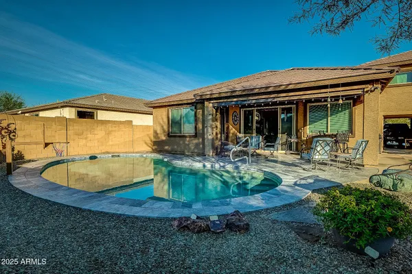 a view of a swimming pool with a patio