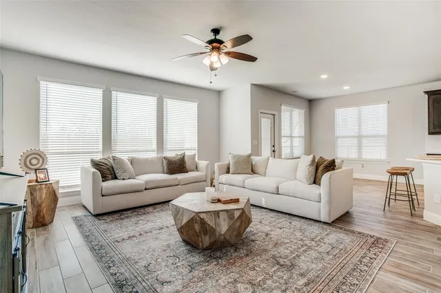 a living room with furniture and a large window