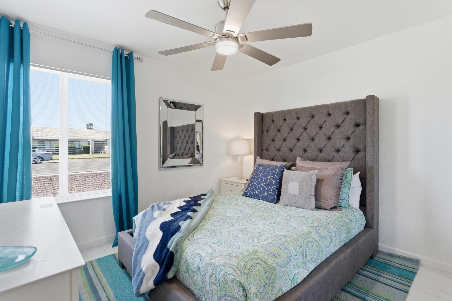 67220 Quijo Road Cathedral City, CA 92234 - Photo 11 of 26 a bedroom with a large bed and a couch