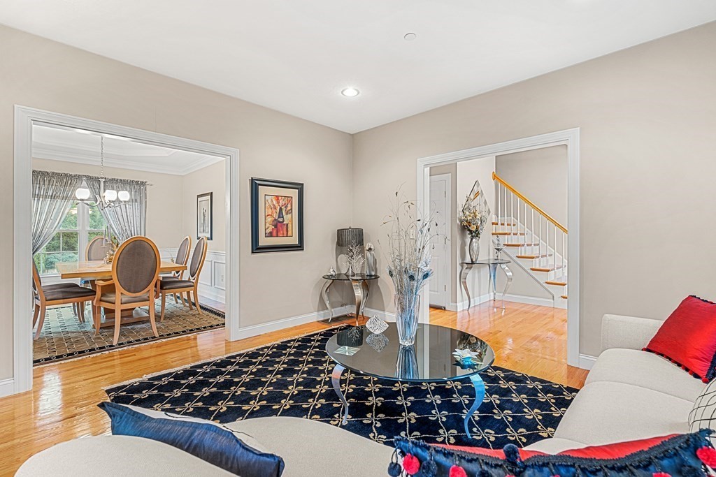 8 Rons Way Framingham, MA 01701 - Photo 11 of 33 a living room with a couch and a table