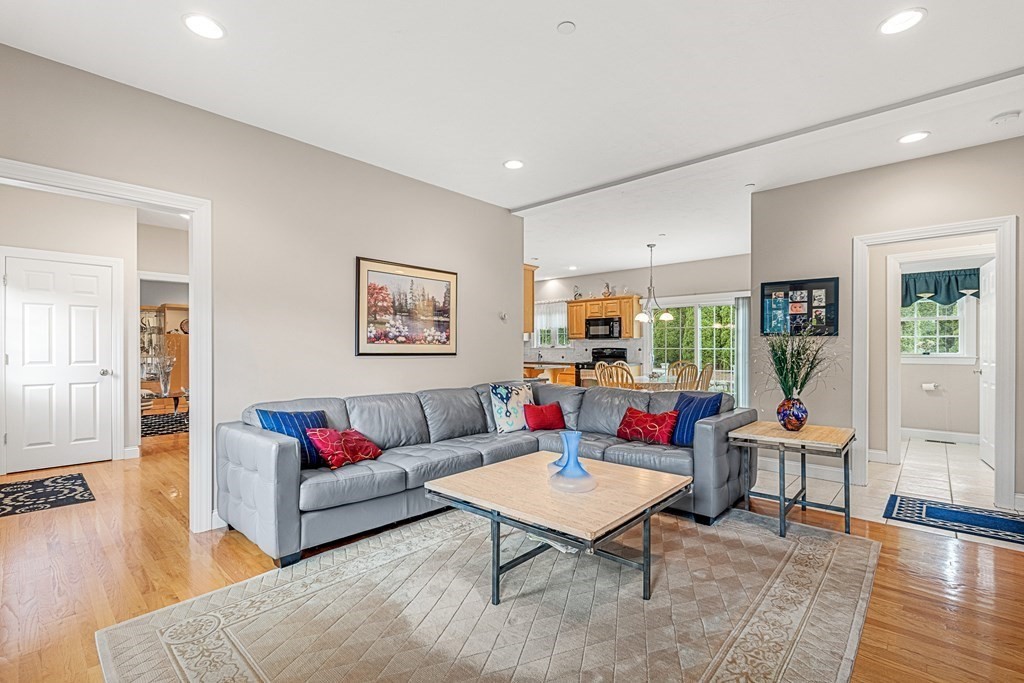8 Rons Way Framingham, MA 01701 - Photo 13 of 33 a living room with furniture a rug and a large window