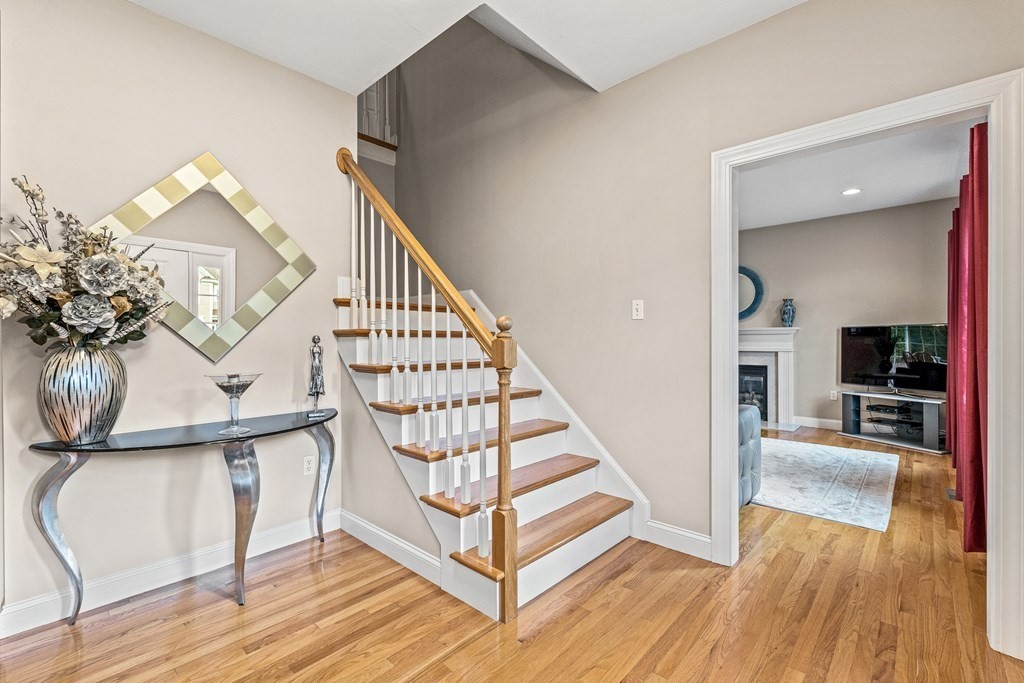 8 Rons Way Framingham, MA 01701 - Photo 15 of 33 a view of entryway and hall with wooden floor