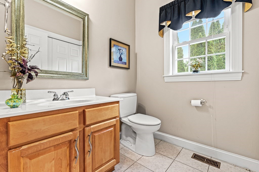 8 Rons Way Framingham, MA 01701 - Photo 16 of 33 a bathroom with a sink toilet and a mirror