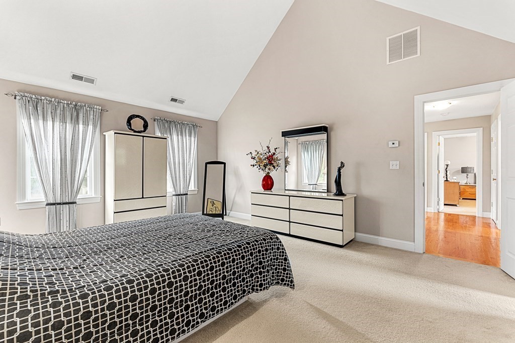 8 Rons Way Framingham, MA 01701 - Photo 17 of 33 a bedroom with a bed and a large mirror