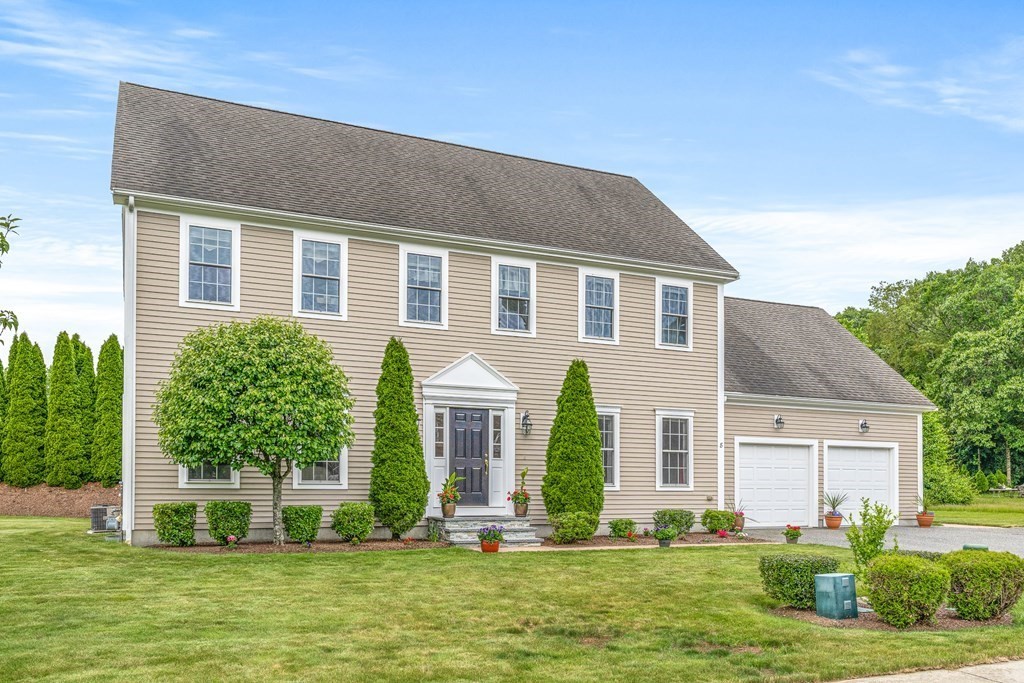 8 Rons Way Framingham, MA 01701 - Photo 2 of 33 a front view of a house with a yard