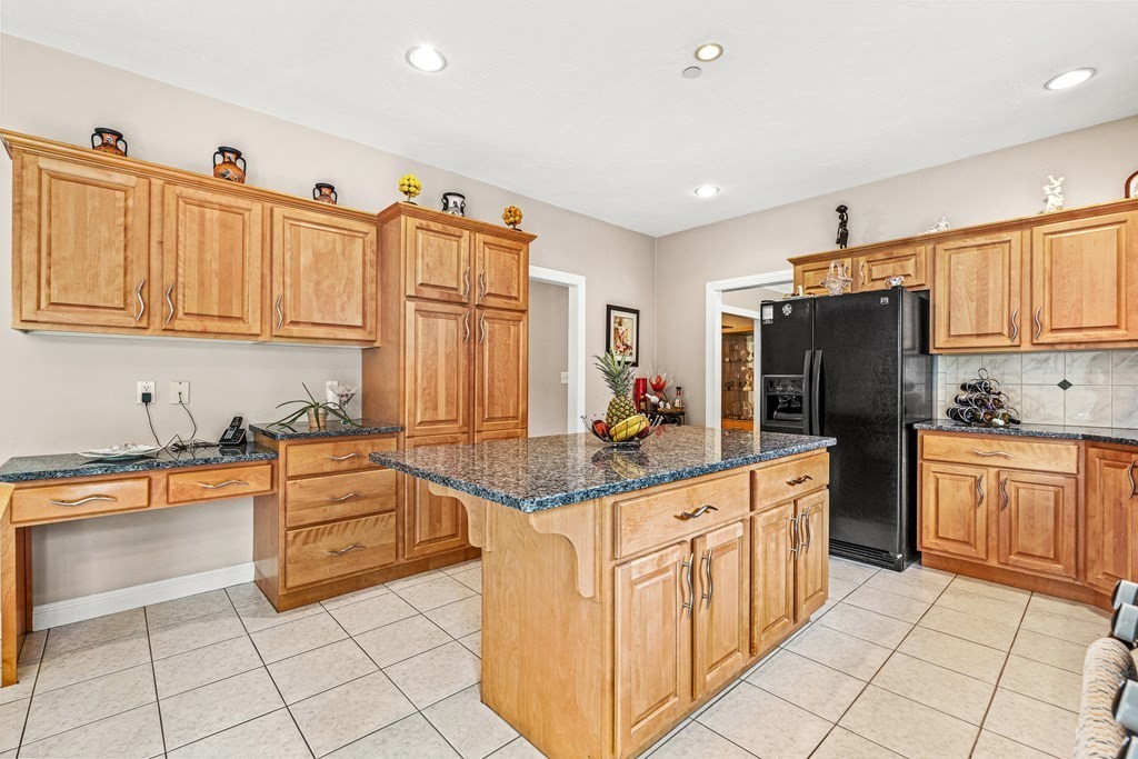 8 Rons Way Framingham, MA 01701 - Photo 5 of 33 a kitchen with stainless steel appliances granite countertop a refrigerator and a sink