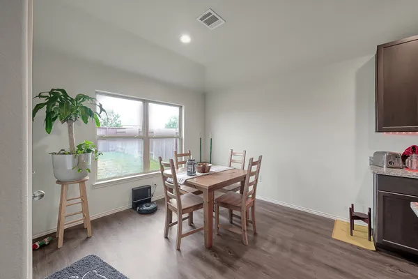a view of a dining room with furniture window and outside view