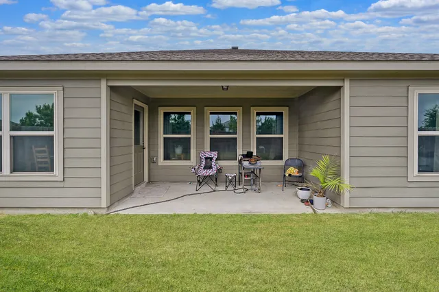 a view of sitting area in front of house
