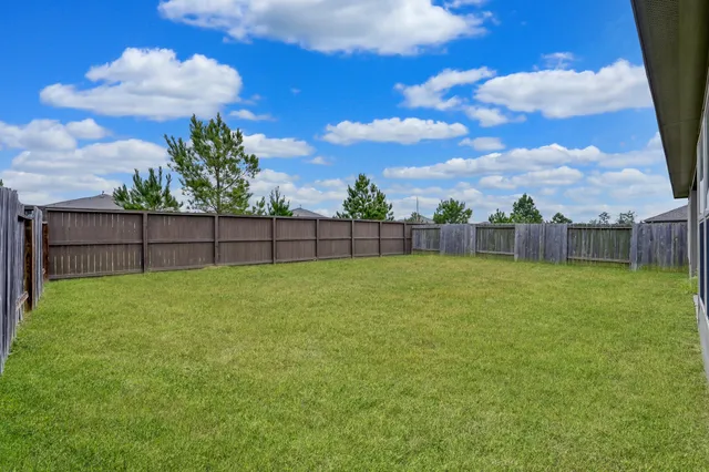 a view of yard with outdoor seating