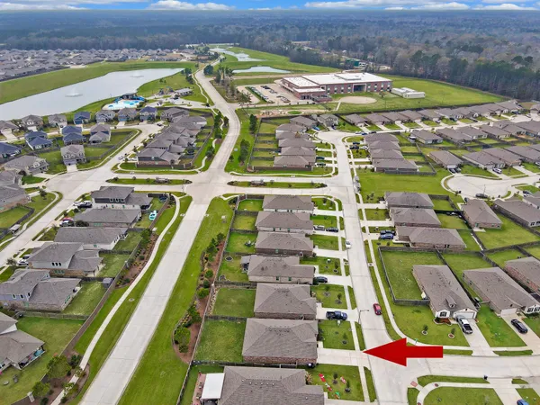 an aerial view of residential houses with outdoor space