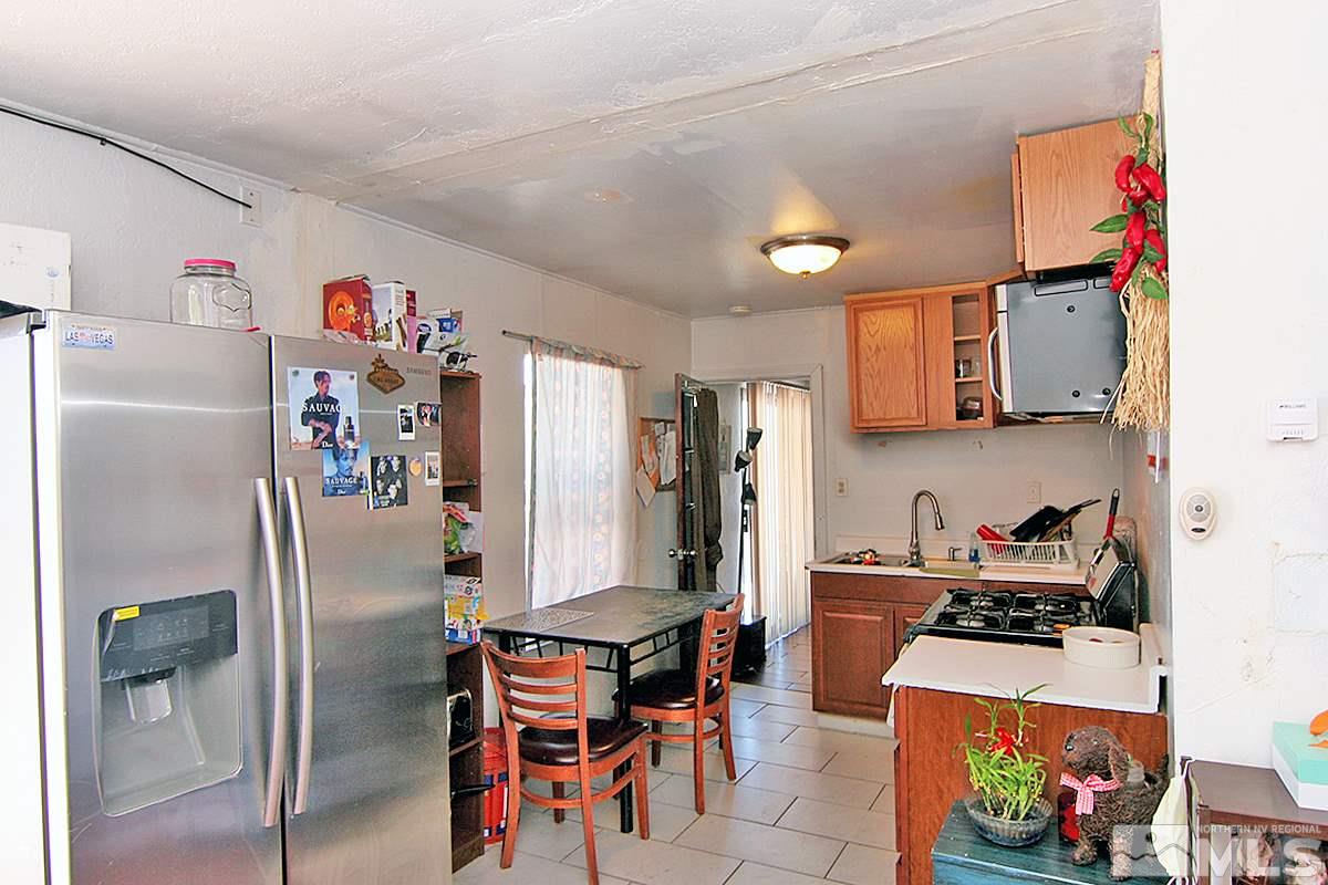 530 East Taylor Street Reno, NV 89502 - Photo 16 of 25 a white refrigerator freezer sitting inside of a kitchen