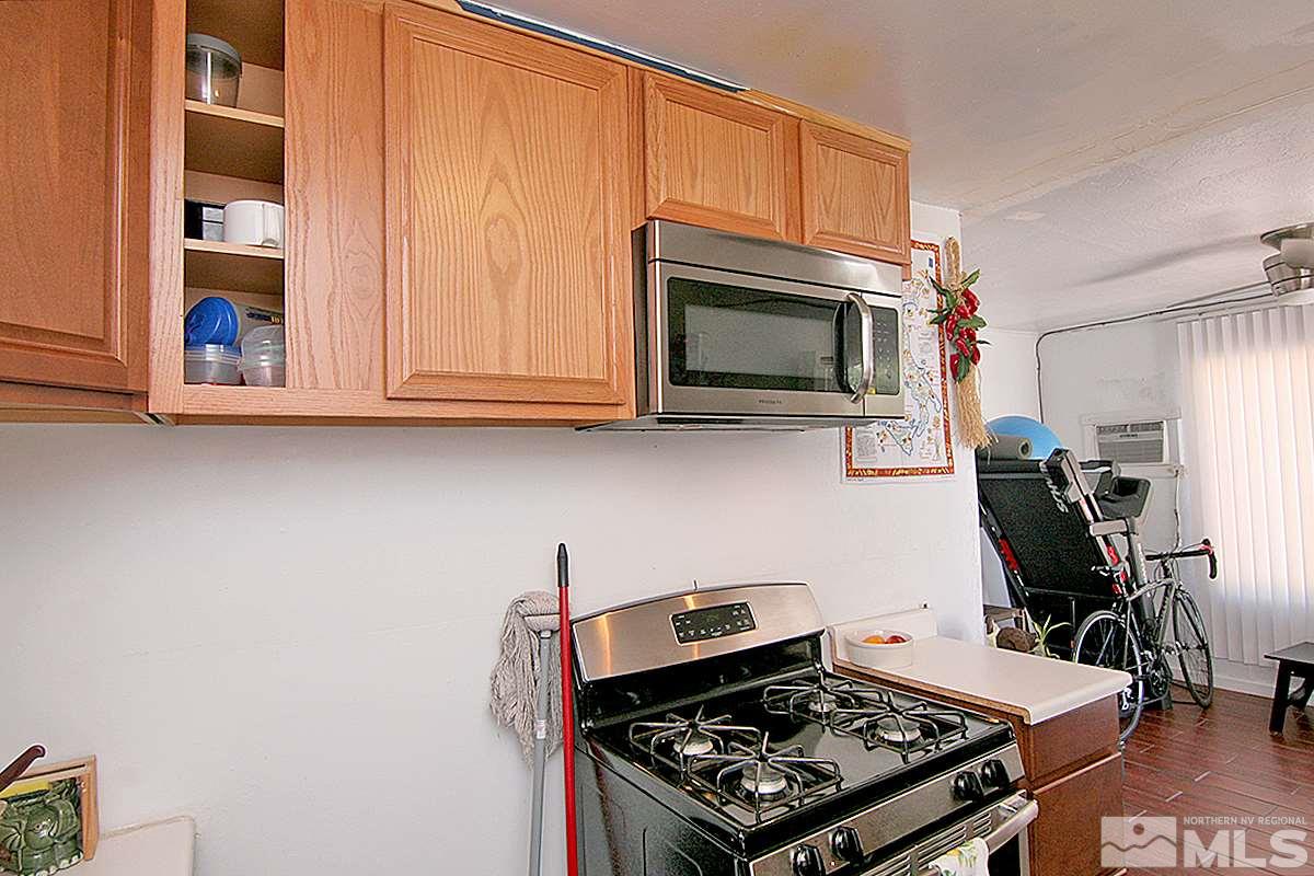 530 East Taylor Street Reno, NV 89502 - Photo 17 of 25 a kitchen with a stove and a microwave