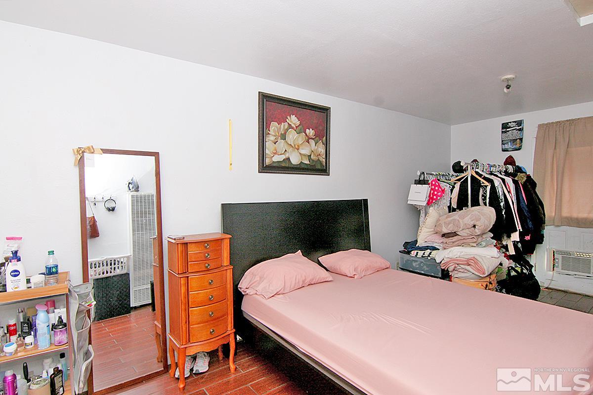 530 East Taylor Street Reno, NV 89502 - Photo 20 of 25 a bedroom with a bed and dresser