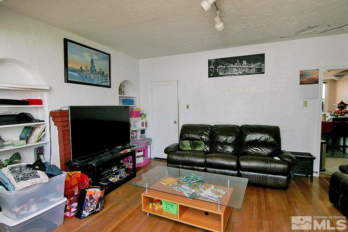 530 East Taylor Street Reno, NV 89502 - Photo 4 of 25 a living room with furniture and a flat screen tv