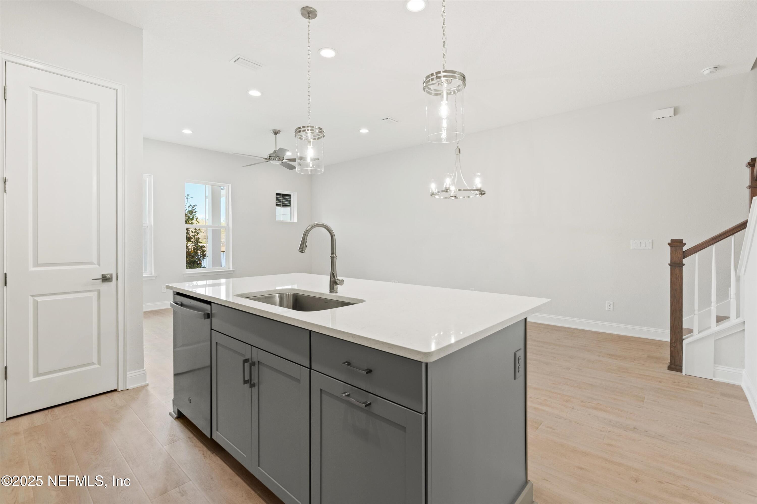 68 Sewall Lane Ponte Vedra, FL 32081 - Photo 13 of 39 a kitchen with a sink dishwasher and a refrigerator with wooden floor