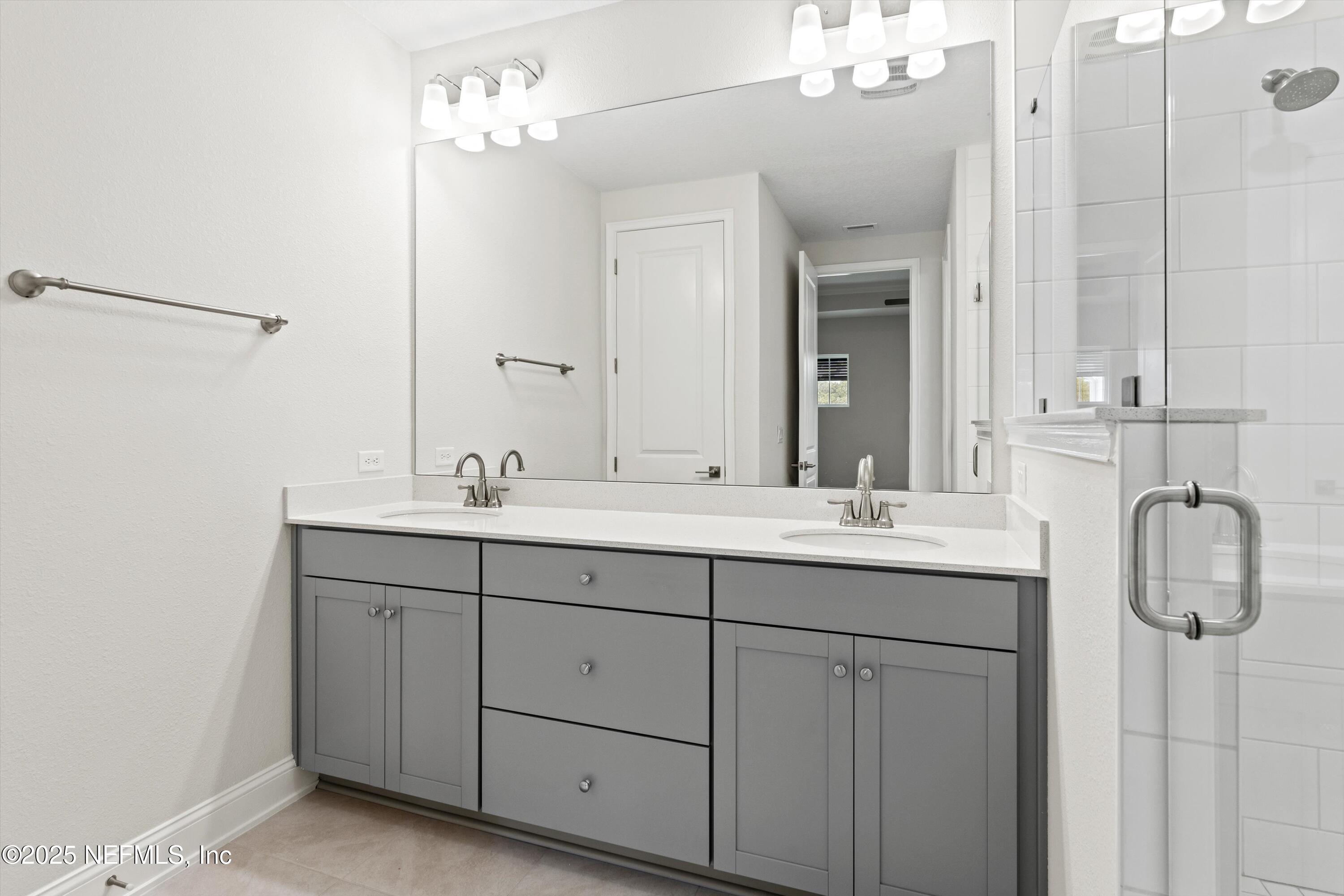 68 Sewall Lane Ponte Vedra, FL 32081 - Photo 18 of 39 a bathroom with 2 sink and a mirror