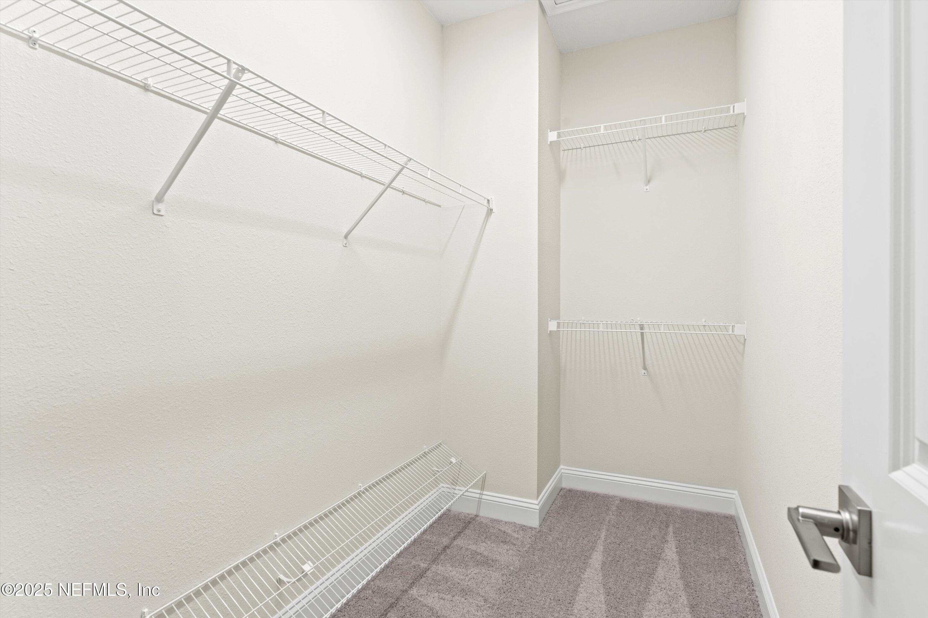 68 Sewall Lane Ponte Vedra, FL 32081 - Photo 20 of 39 a view of a room with racks on the wall
