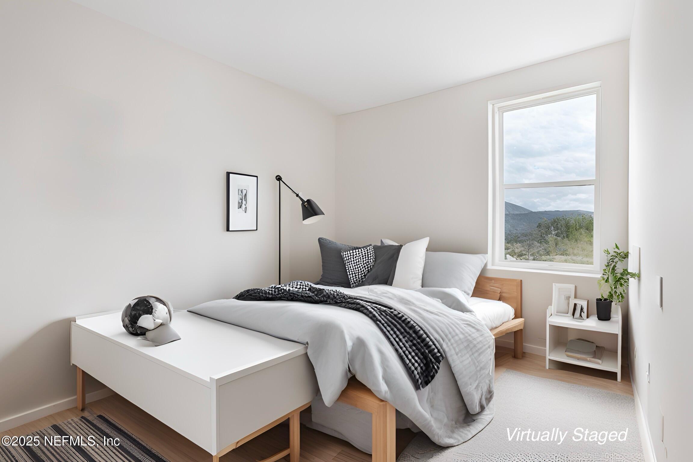 68 Sewall Lane Ponte Vedra, FL 32081 - Photo 21 of 39 a bedroom with a bed and a window