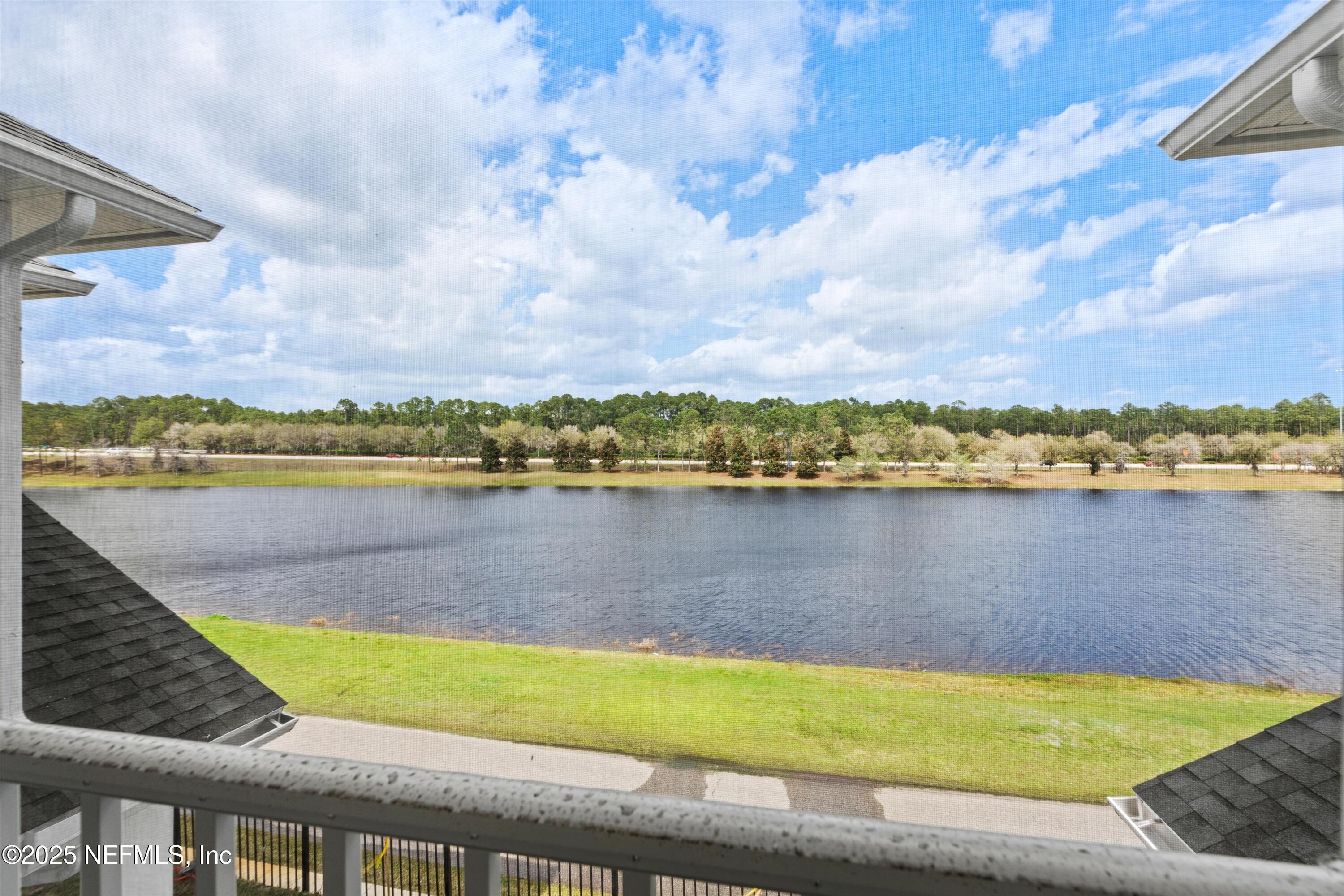 68 Sewall Lane Ponte Vedra, FL 32081 - Photo 25 of 39 a view of a lake with houses in the back