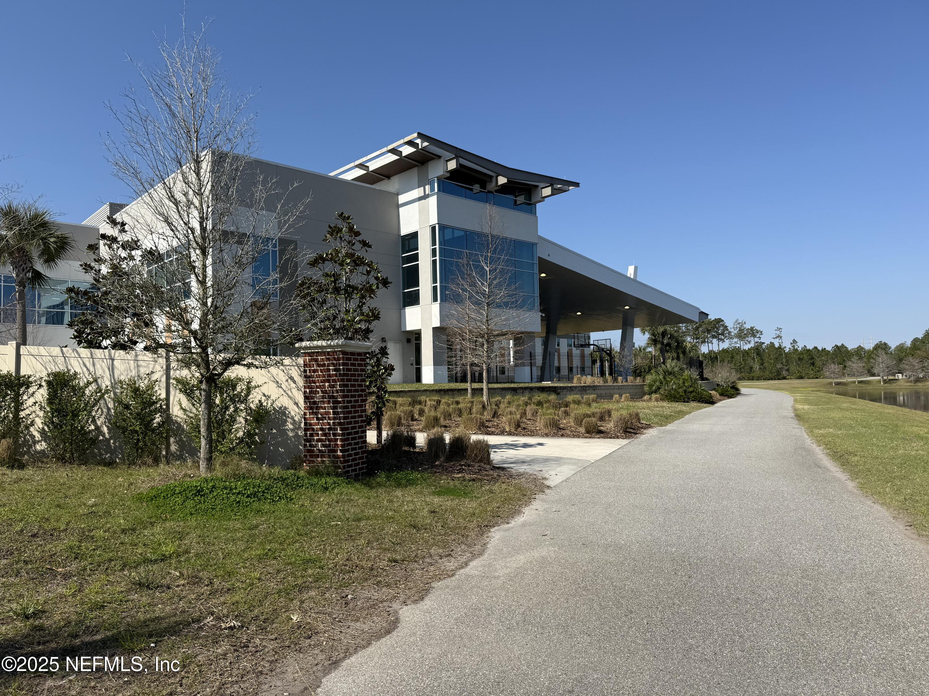 68 Sewall Lane Ponte Vedra, FL 32081 - Photo 27 of 39 a front view of a house with a garden