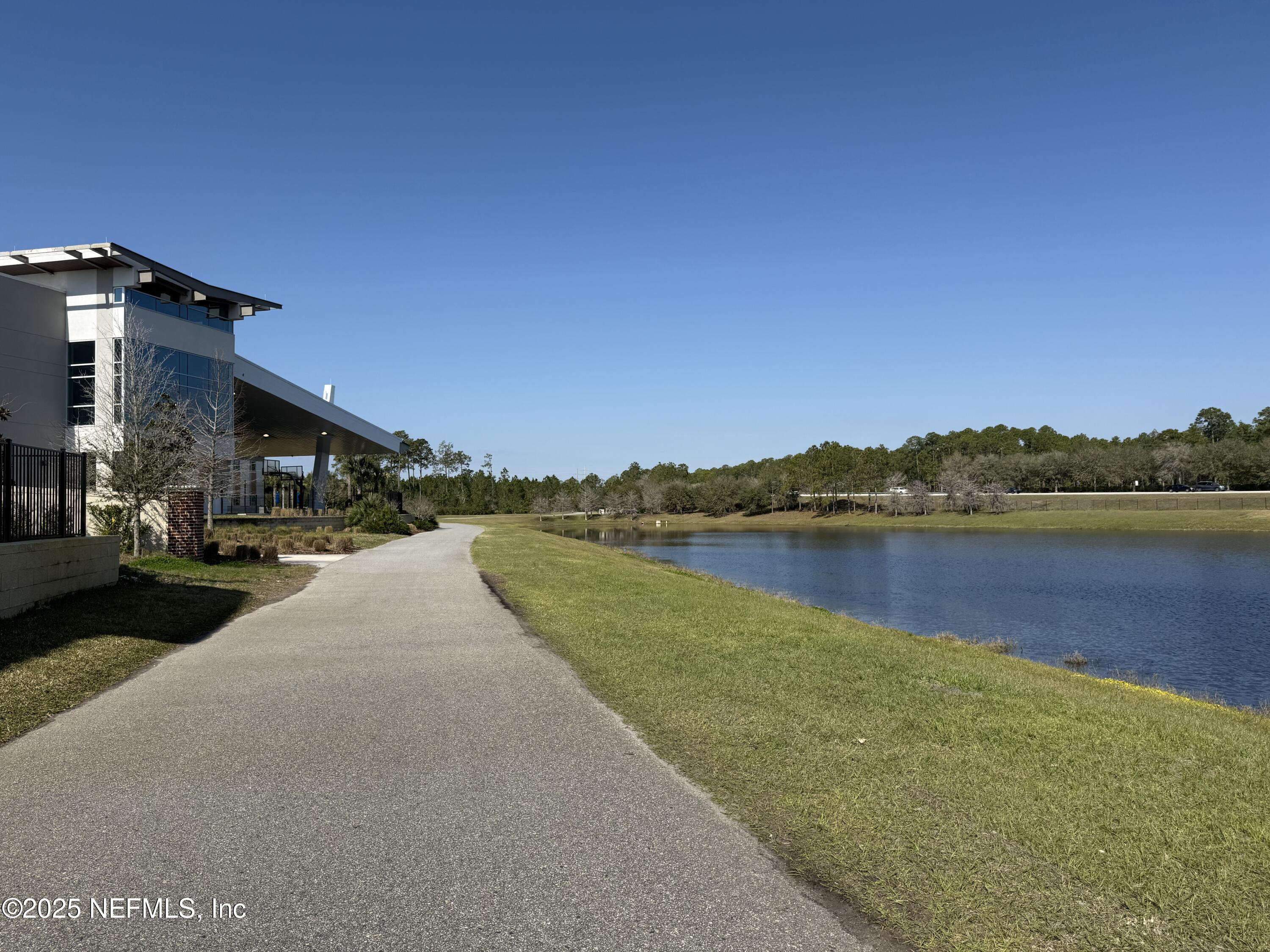 68 Sewall Lane Ponte Vedra, FL 32081 - Photo 28 of 39 a view of a lake with a house in the background