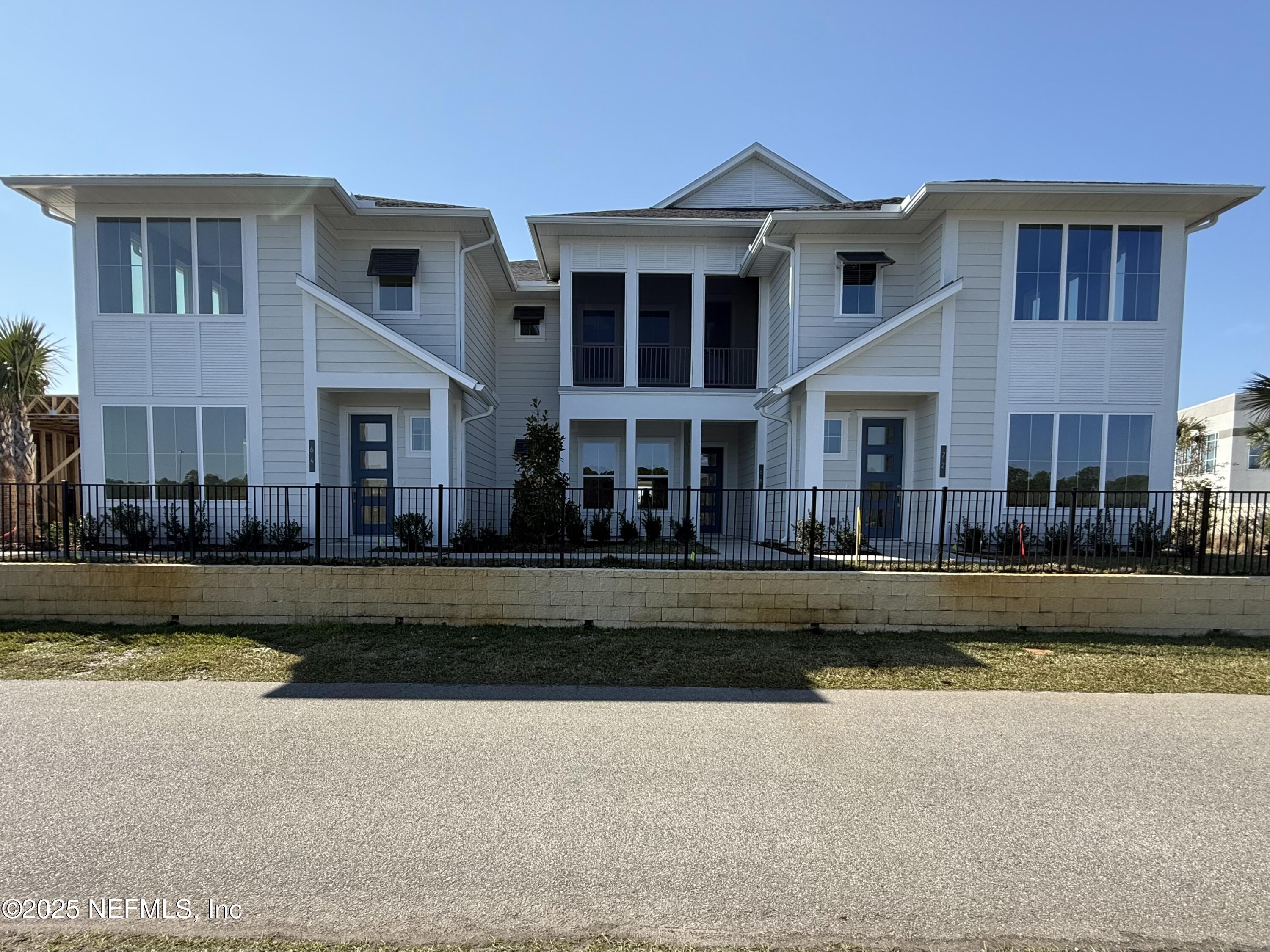 68 Sewall Lane Ponte Vedra, FL 32081 - Photo 4 of 39 a front view of a house with a yard