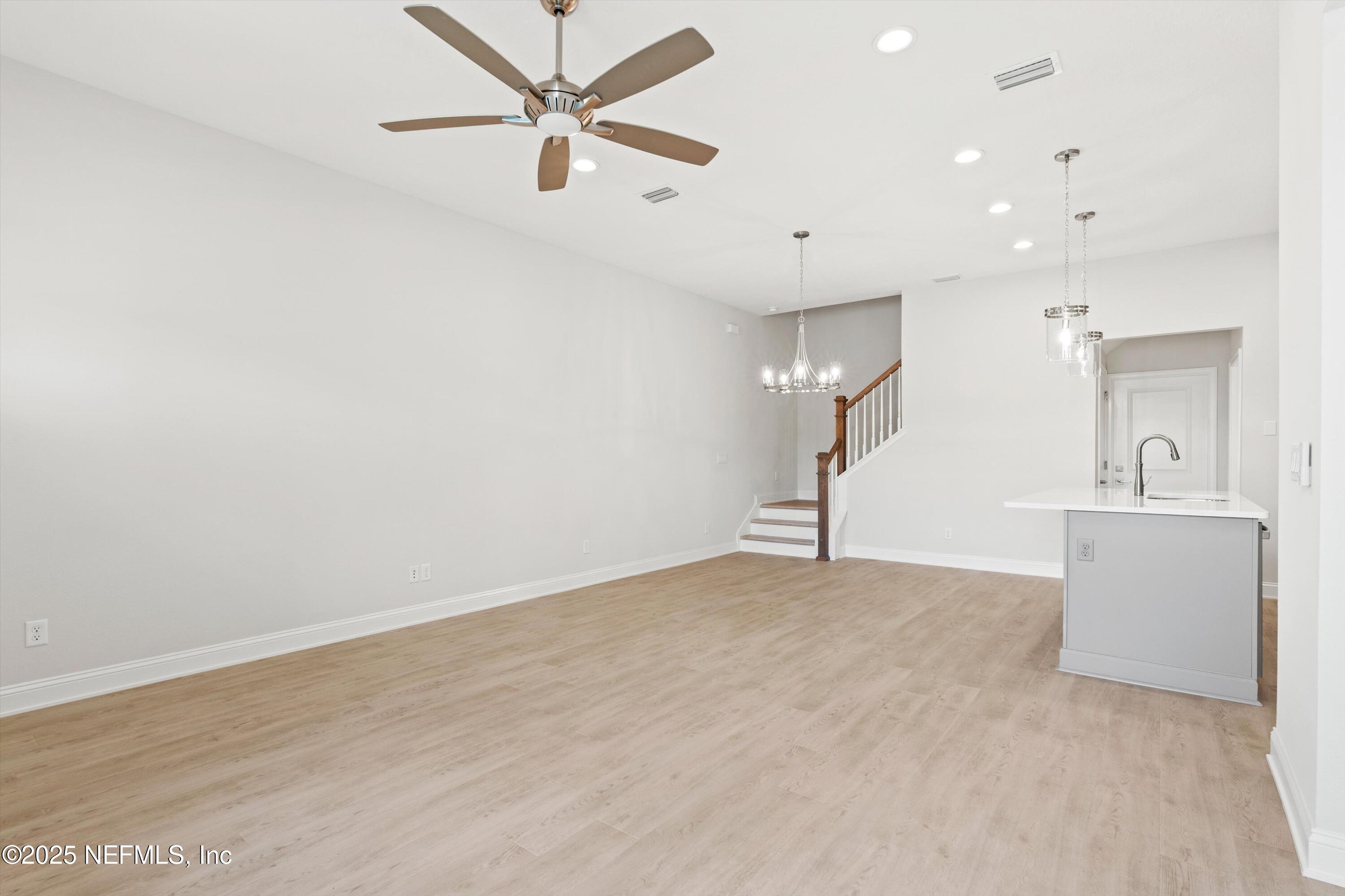 68 Sewall Lane Ponte Vedra, FL 32081 - Photo 7 of 39 a view of a big room with a ceiling fan and wooden floor