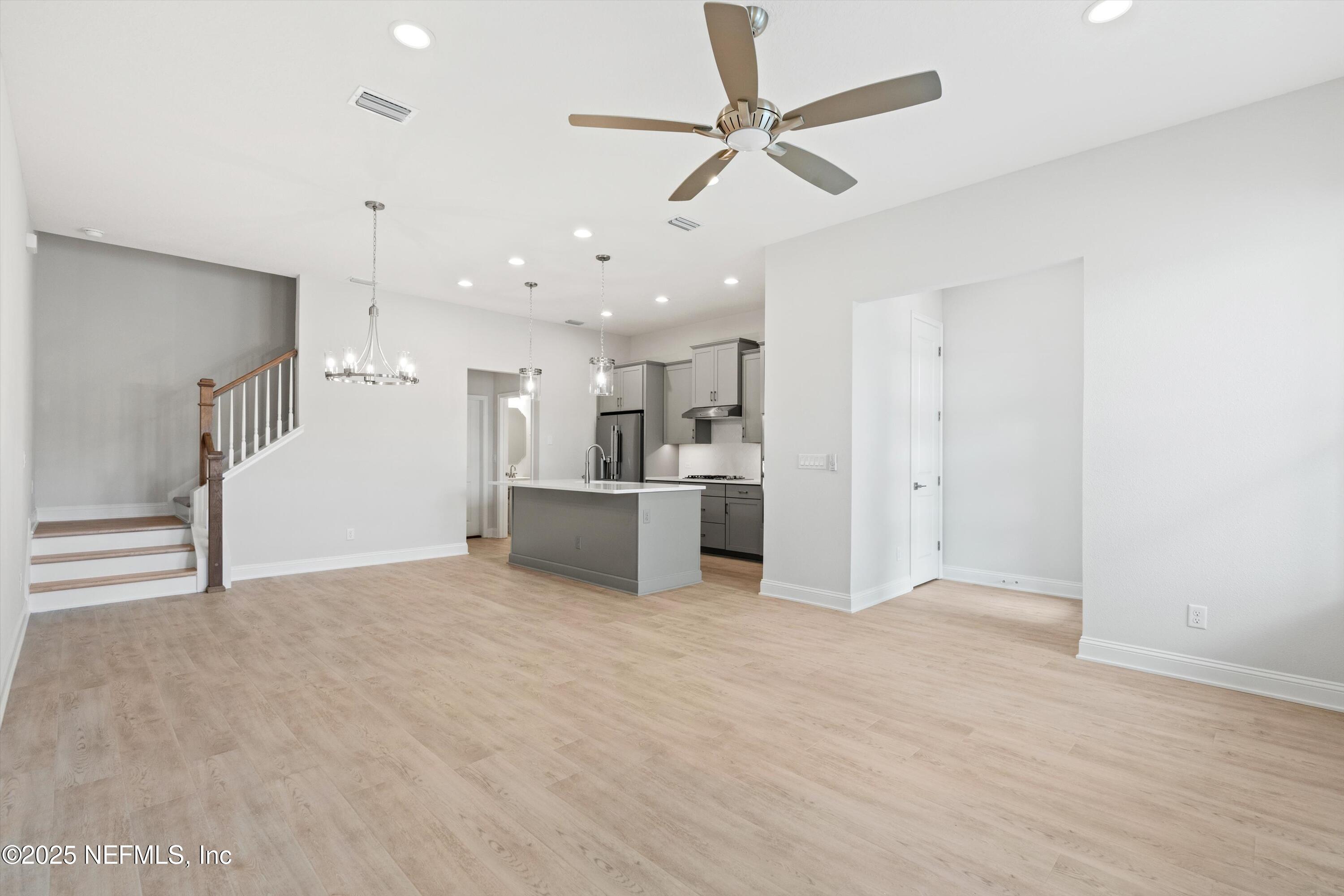 68 Sewall Lane Ponte Vedra, FL 32081 - Photo 8 of 39 a view of a kitchen with a sink and a refrigerator