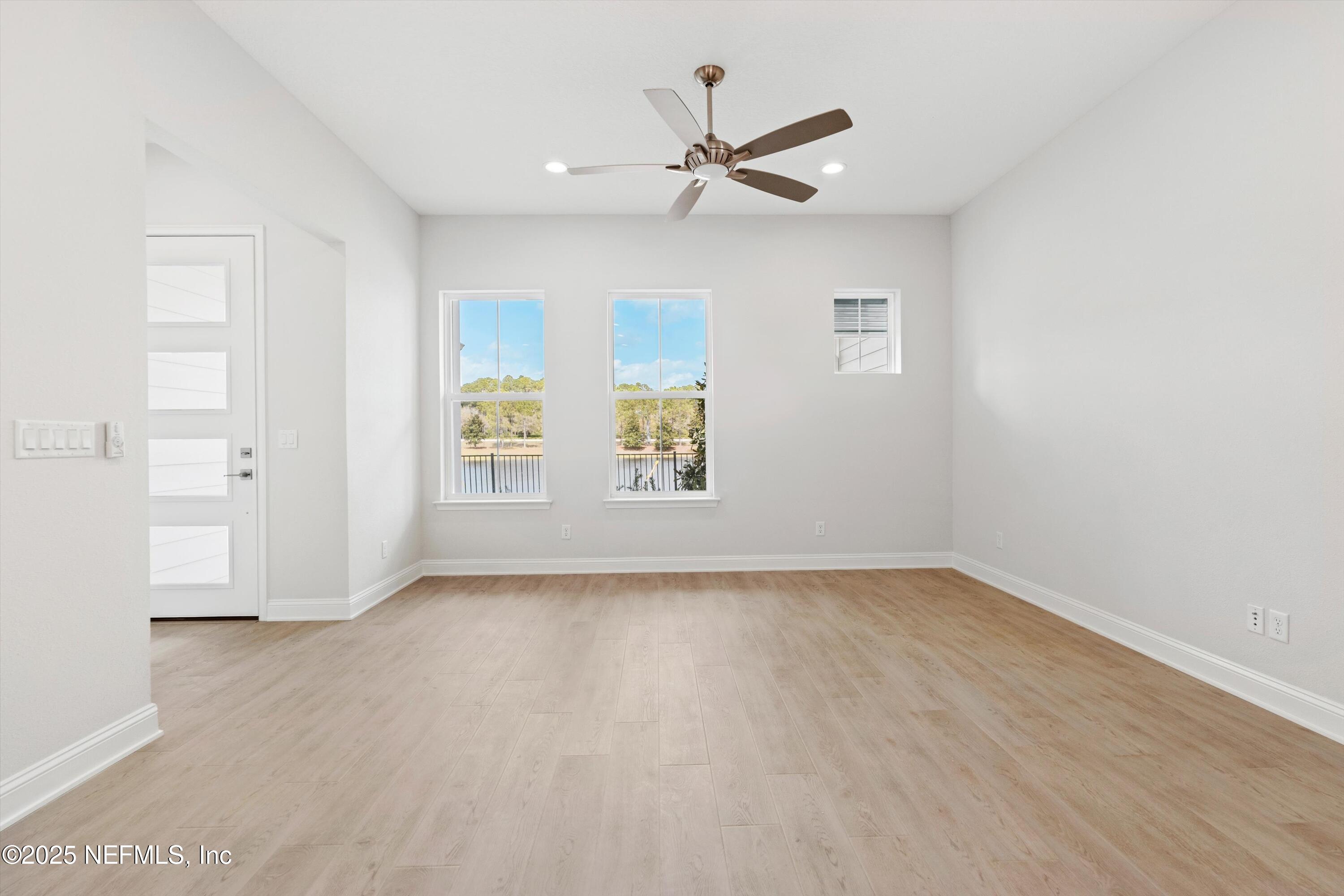 68 Sewall Lane Ponte Vedra, FL 32081 - Photo 9 of 39 wooden floor in an empty room with a window