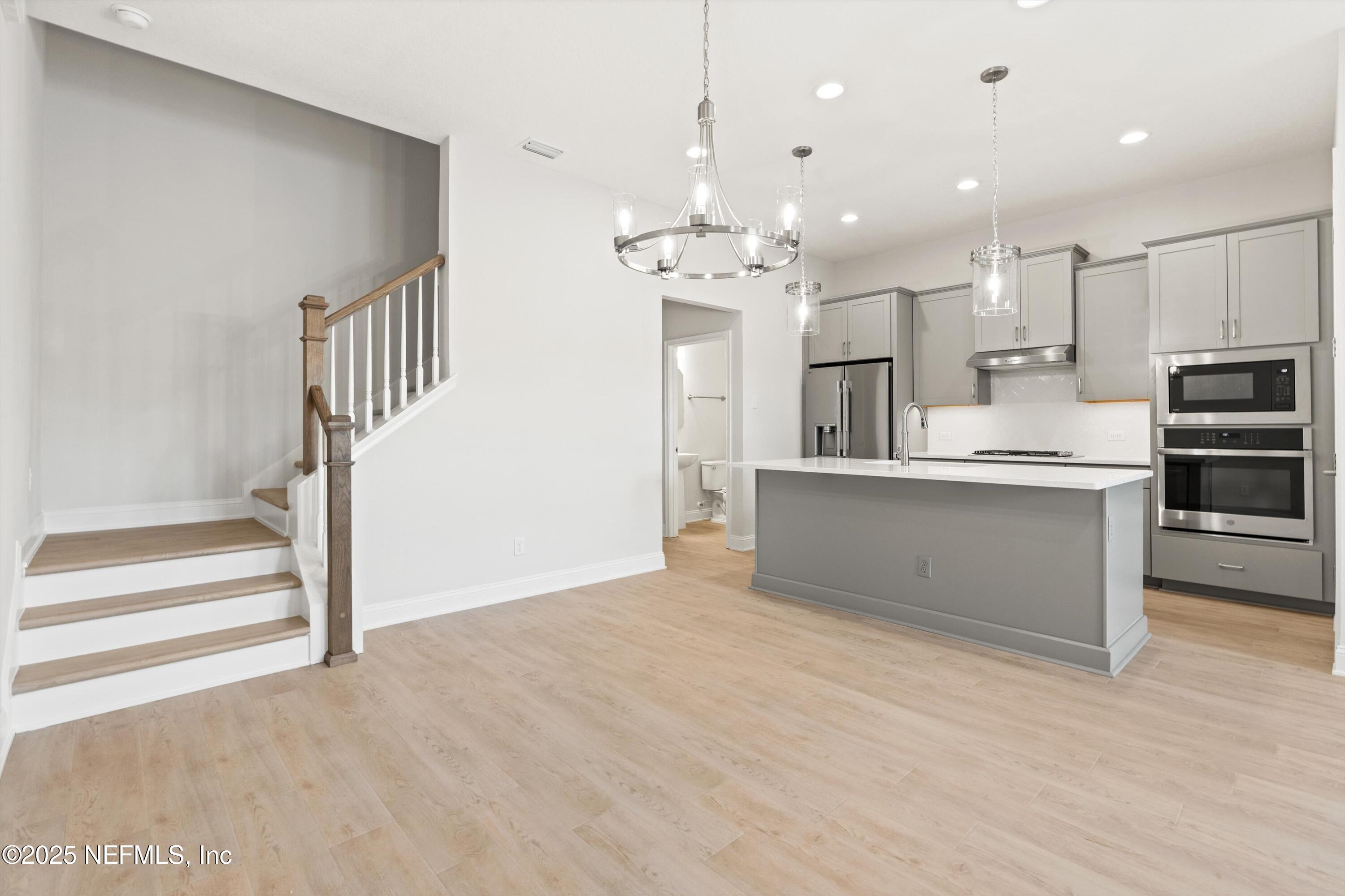 68 Sewall Lane Ponte Vedra, FL 32081 - Photo 10 of 39 a view of kitchen with cabinets and refrigerator