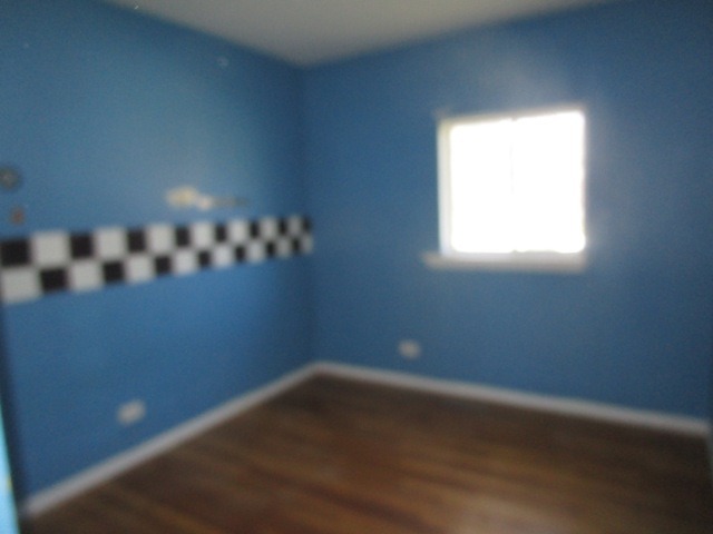 75 Tweed Road Fox Lake, IL 60020 - Photo 13 of 17 a view of an empty room with a window
