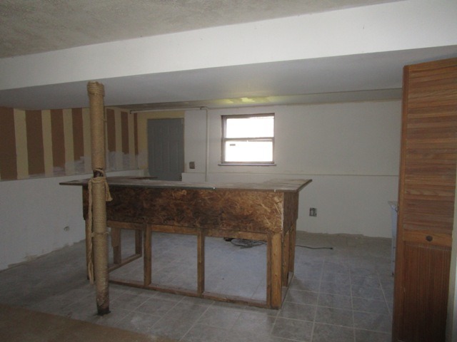 75 Tweed Road Fox Lake, IL 60020 - Photo 9 of 17 a room with a chair and a window