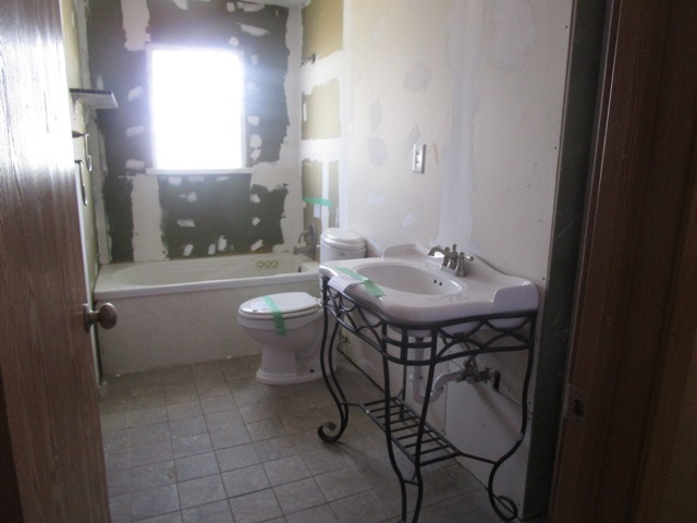 75 Tweed Road Fox Lake, IL 60020 - Photo 10 of 17 a bathroom with a sink toilet and shower