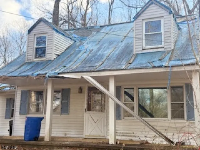a view of a house with wooden deck