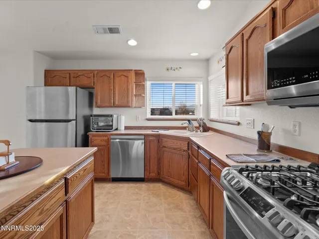 a spacious bathroom with a tub double sink and a mirror