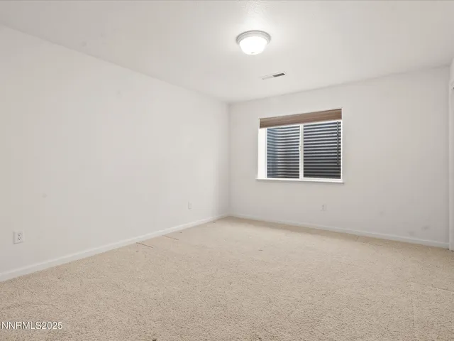 an aerial view of a houses with a city view