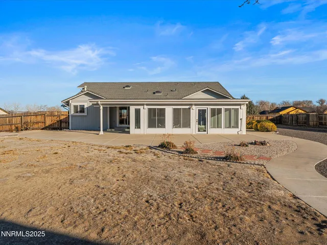 an aerial view of a house with a ocean view