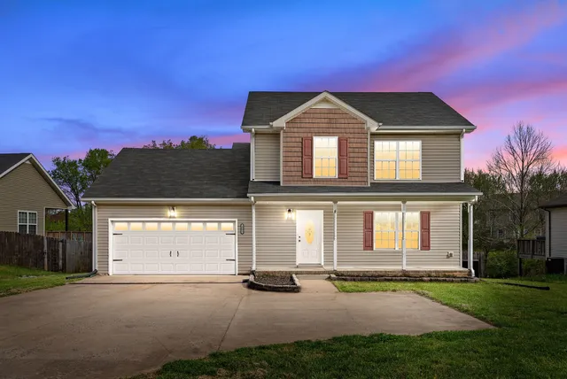 front view of a house with a yard