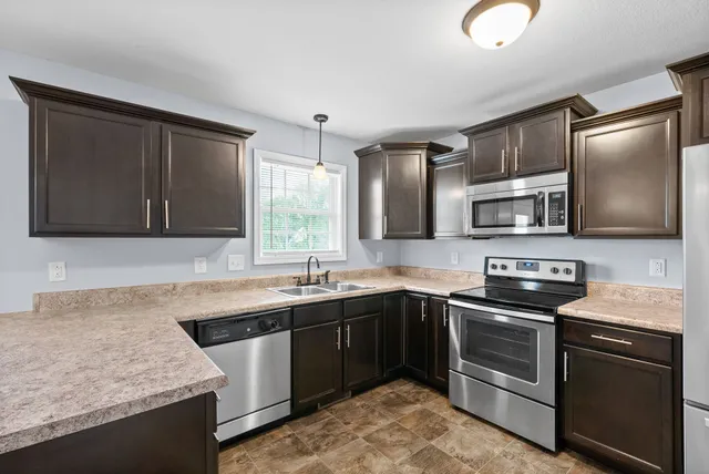 a kitchen with a sink and cabinets