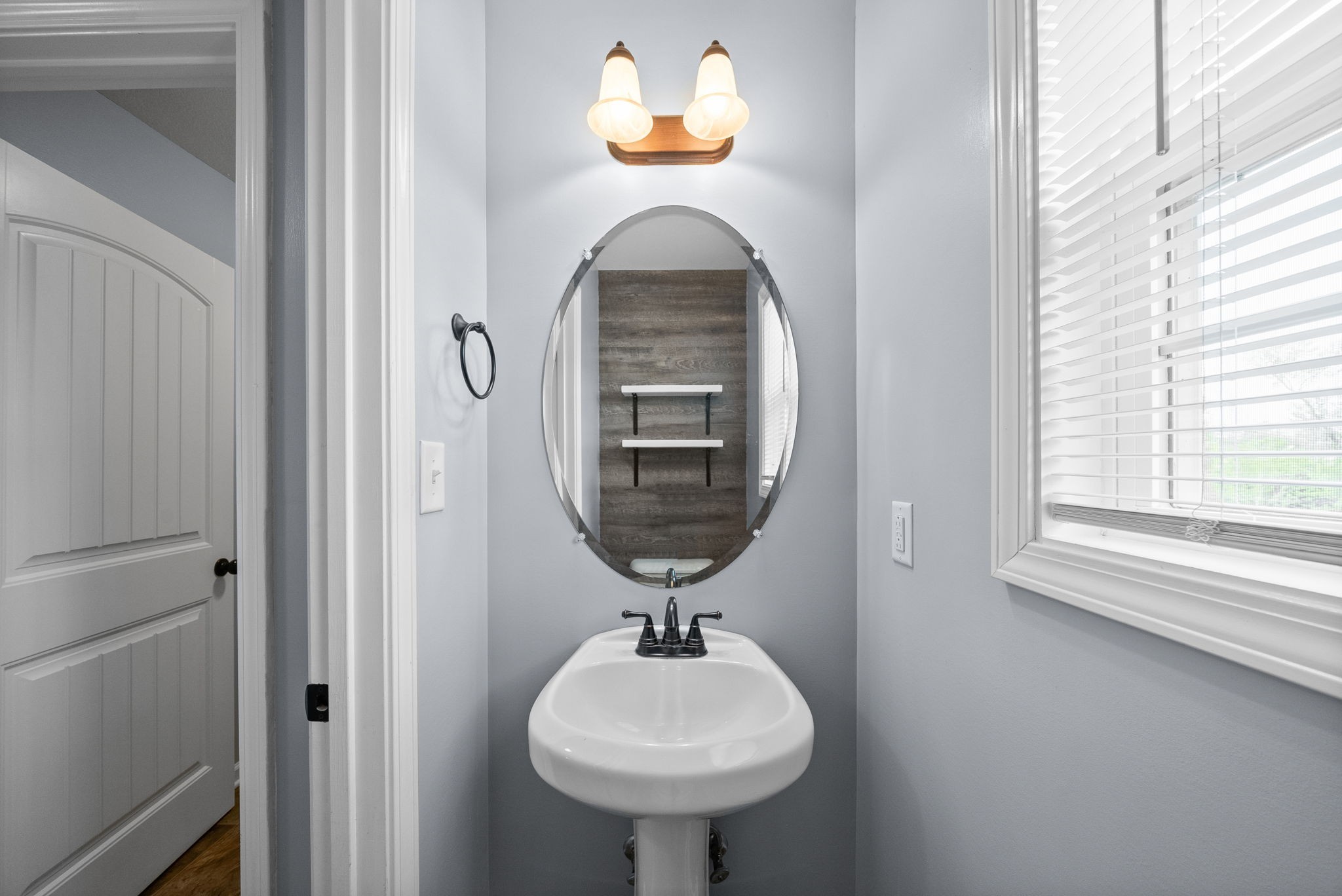 1563 Hazelwood Road Clarksville, TN 37042 - Photo 18 of 43 a bathroom with a sink and a mirror