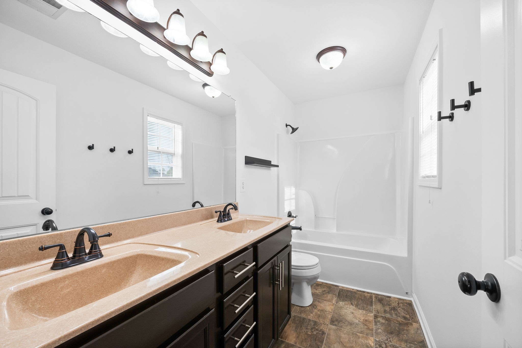 1563 Hazelwood Road Clarksville, TN 37042 - Photo 22 of 43 a bathroom with a sink double vanity granite tub shower and a mirror