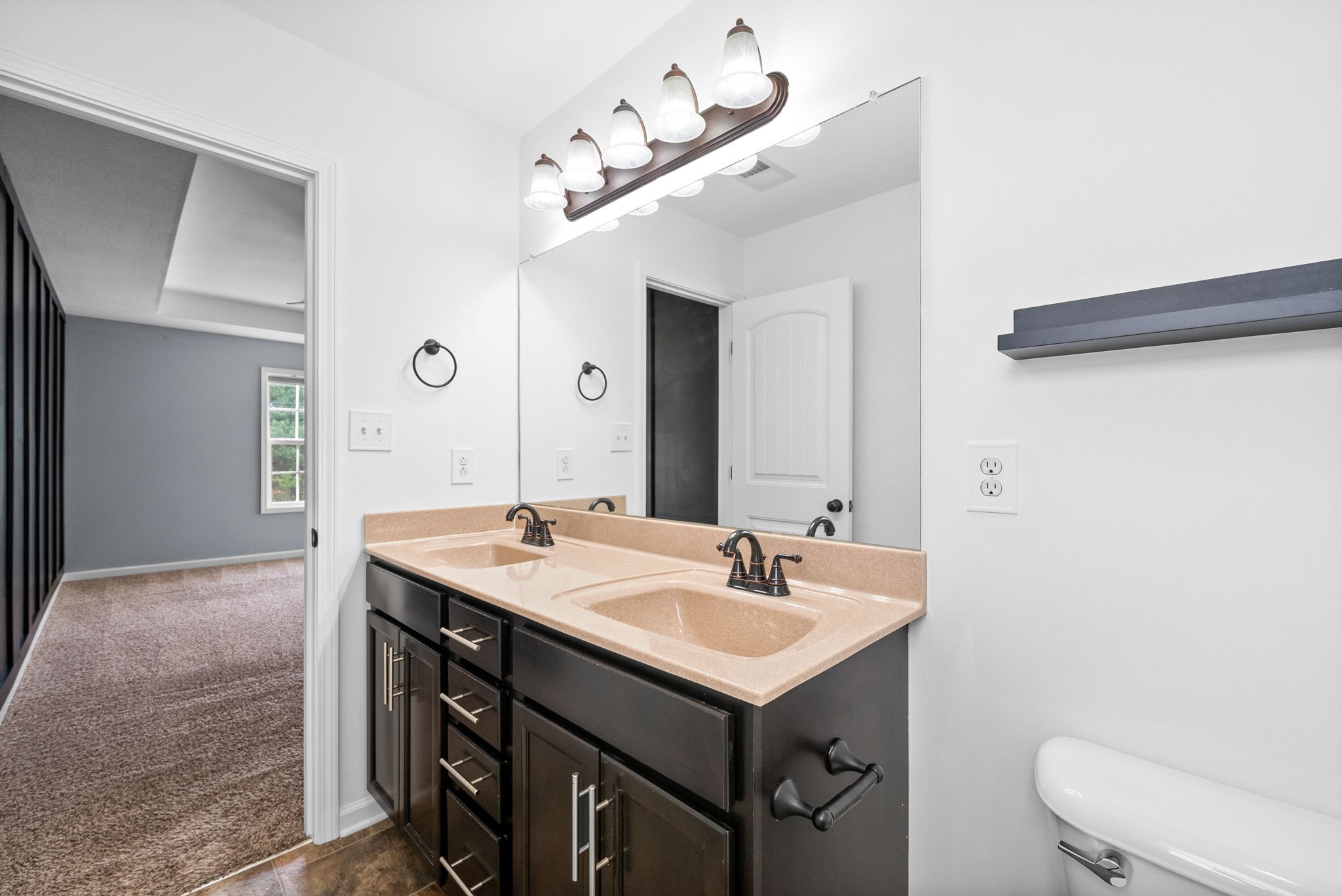 1563 Hazelwood Road Clarksville, TN 37042 - Photo 23 of 43 a bathroom with a sink vanity and a mirror