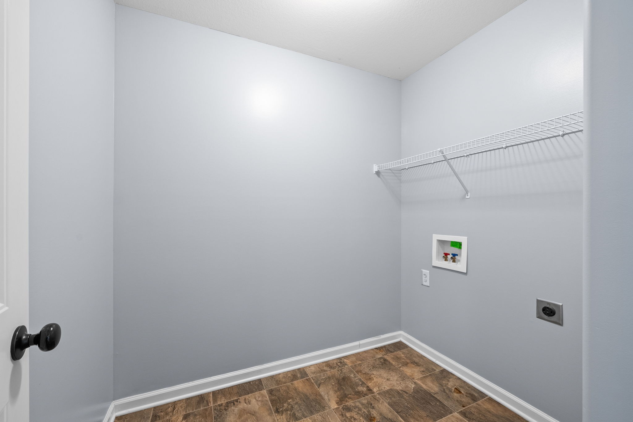 1563 Hazelwood Road Clarksville, TN 37042 - Photo 32 of 43 a view of small space with empty racks on the wall