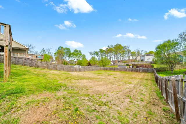 an aerial view of a house with a garden and swimming pool