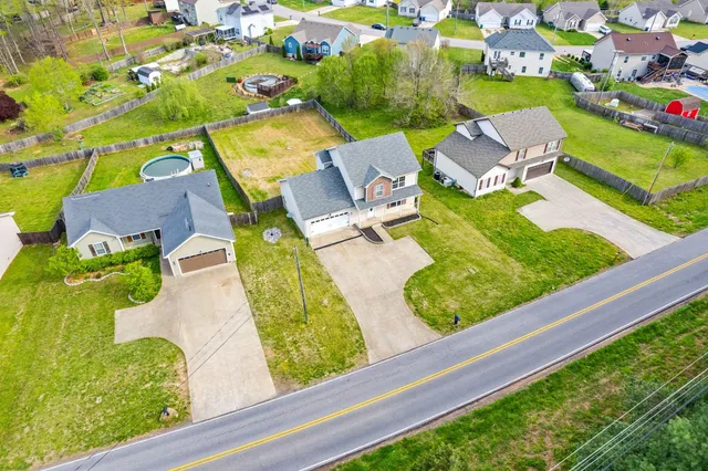 an aerial view of a house with outdoor space